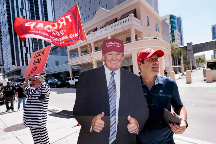 epa10688981 A Trump supporter outside of the Wilkie D. Ferguson United States Courthouse where former President Donald Trump is scheduled to surrender today to federal authorities in Miami, Florida, USA, 13 June 2023. Trump is facing multiple federal charges stemming from an US Justice Department investigation led by Special Counsel Jack Smith related to Trump’s alleged mishandling of classified national security documents. EPA/JUSTIN LANE