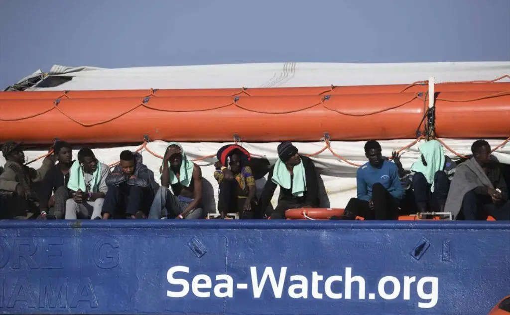 Migranti a bordo della Sea Watch (Ansa)