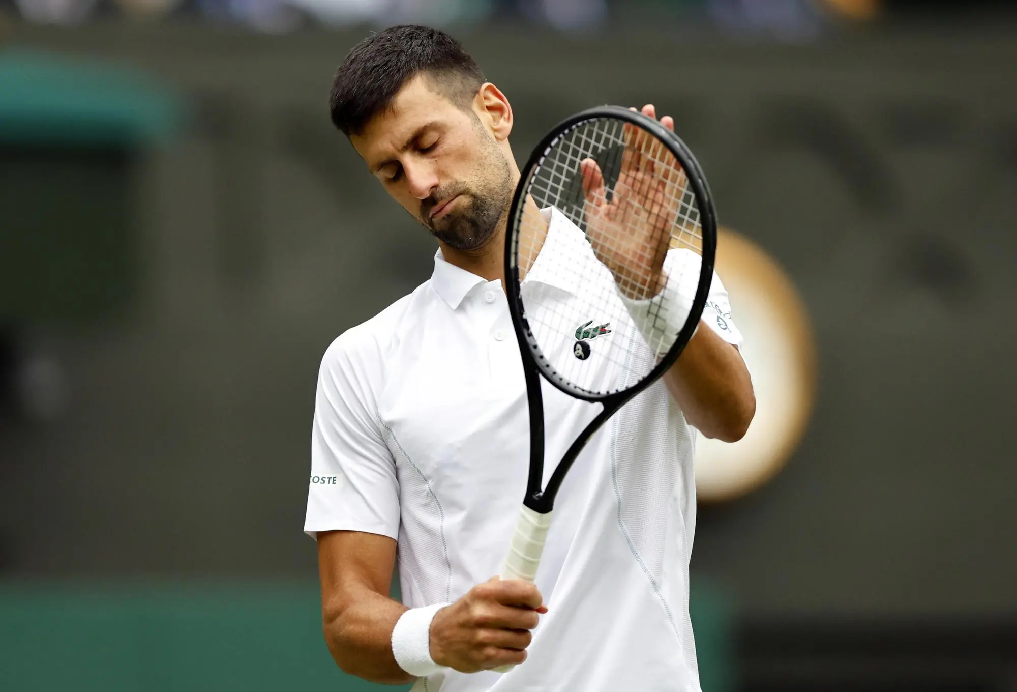 epa11474920 Novak Djokovic of Serbia reacts during the Men's semifinal match against Lorenzo Musetti of Italy at the Wimbledon Championships, Wimbledon, Britain, 12 July 2024. EPA/TOLGA AKMEN EDITORIAL USE ONLY