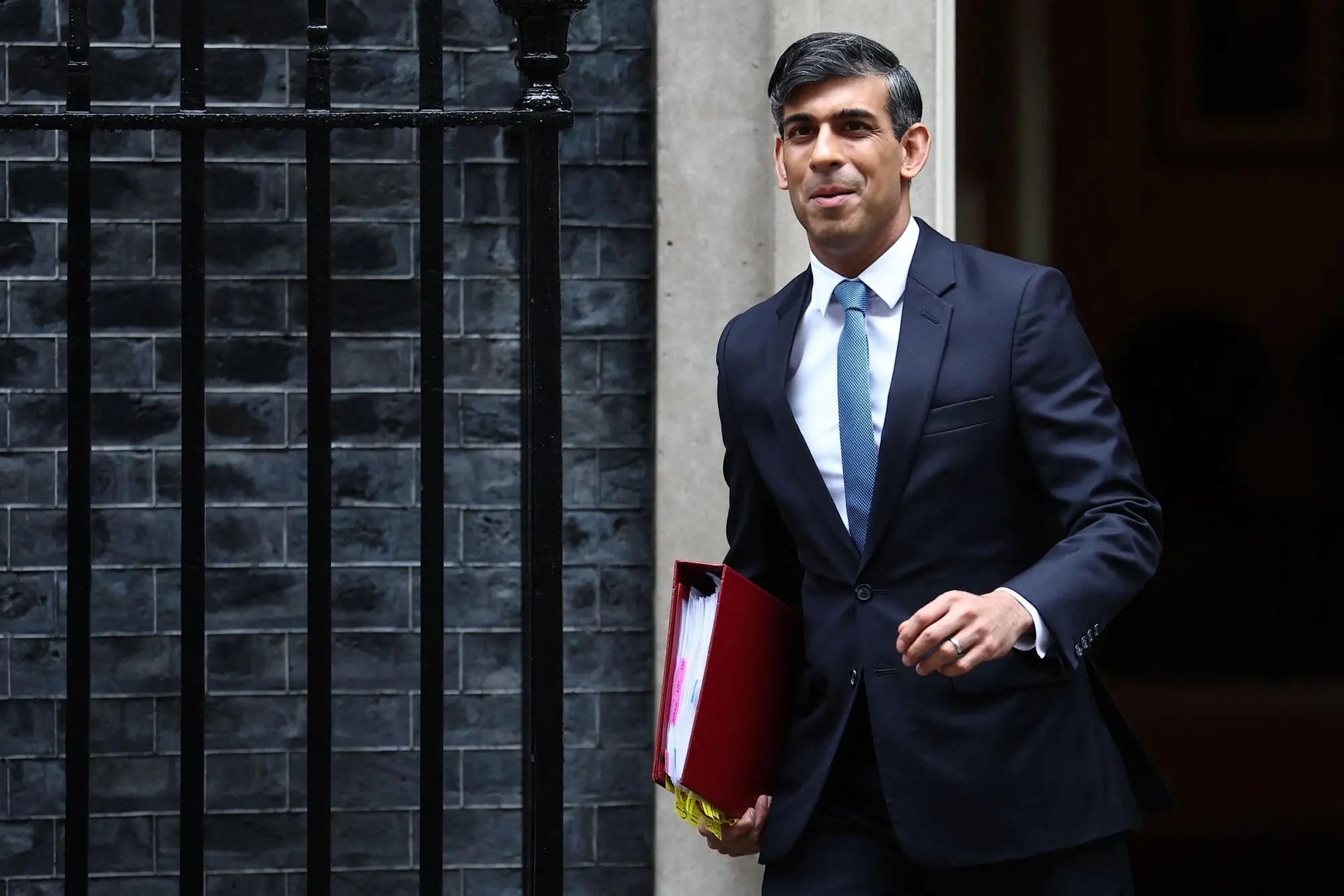 Britain's Prime Minister Rishi Sunak leaves 10 Downing Street in central London on May 22, 2024 to take part in the weekly session of Prime Minister's Questions (PMQs) in the House of Commons. (Photo by HENRY NICHOLLS / AFP)