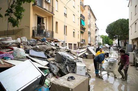 People at work to clean their homes from the rubble following the flood that is affecting Emilia Romagna, in Faenza, Italy, 19 May 2023. A new wave of torrential rain is hitting Italy, especially the northeastern region of Emilia-Romagna and other parts of the Adriatic coast.