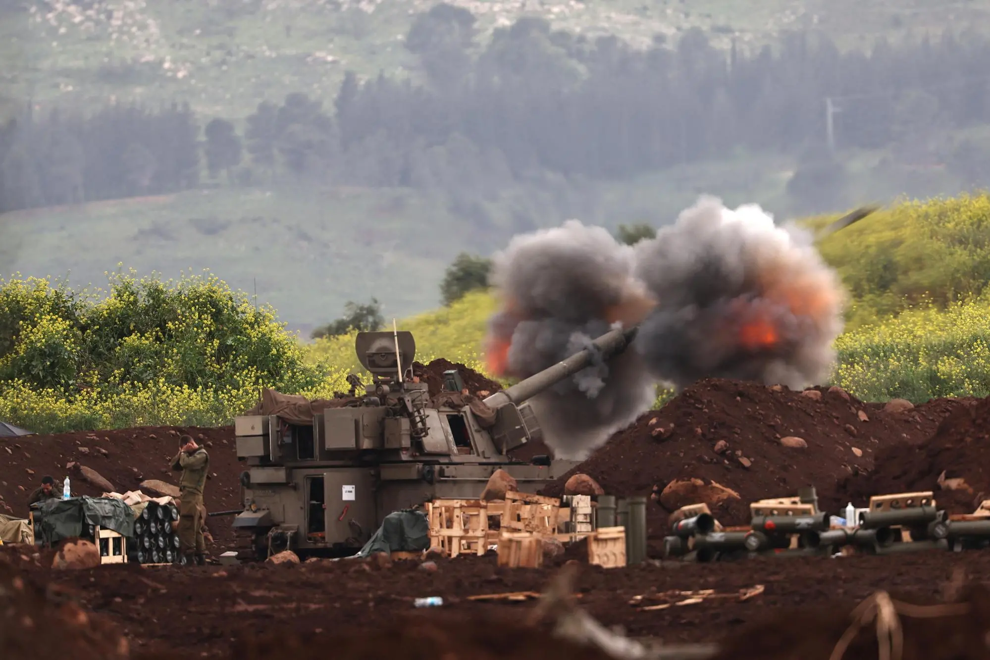 epa12821496 An Israeli artillery fires shells towards targets in Lebanon at an undisclosed position near the Israel-Lebanon border, 15 March 2026. The Israeli military stated it is conducting strikes across Lebanon targeting Hezbollah infrastructure and personnel. EPA/ATEF SAFADI
