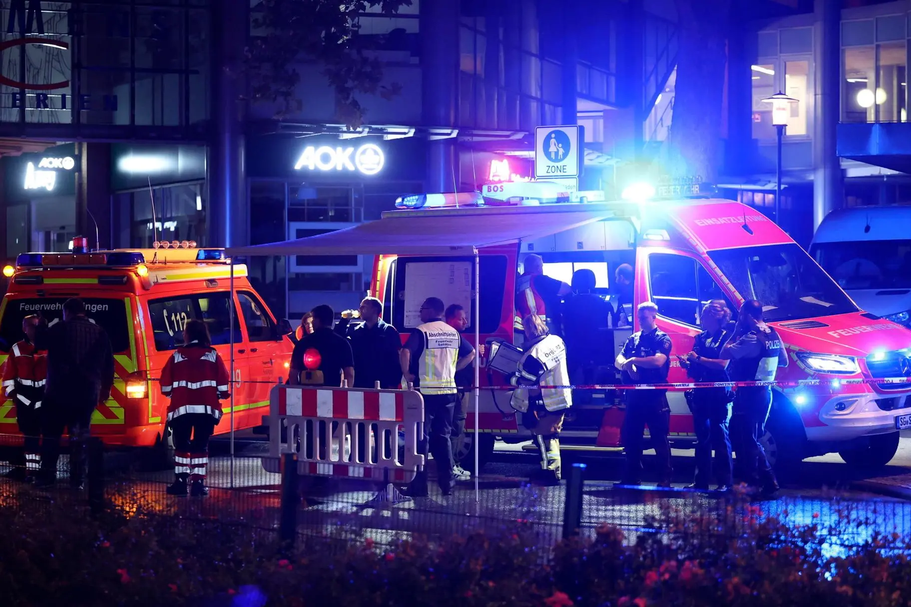 epa11562299 Emergency services after a knife attack during the city festival in a street in Solingen, Germany, 23 August 2024. According to the police, at around 9.45 pm a man stabbed passers-by at random with a knife at the city festival in Solingen. EPA/CHRISTOPHER NEUNDORF