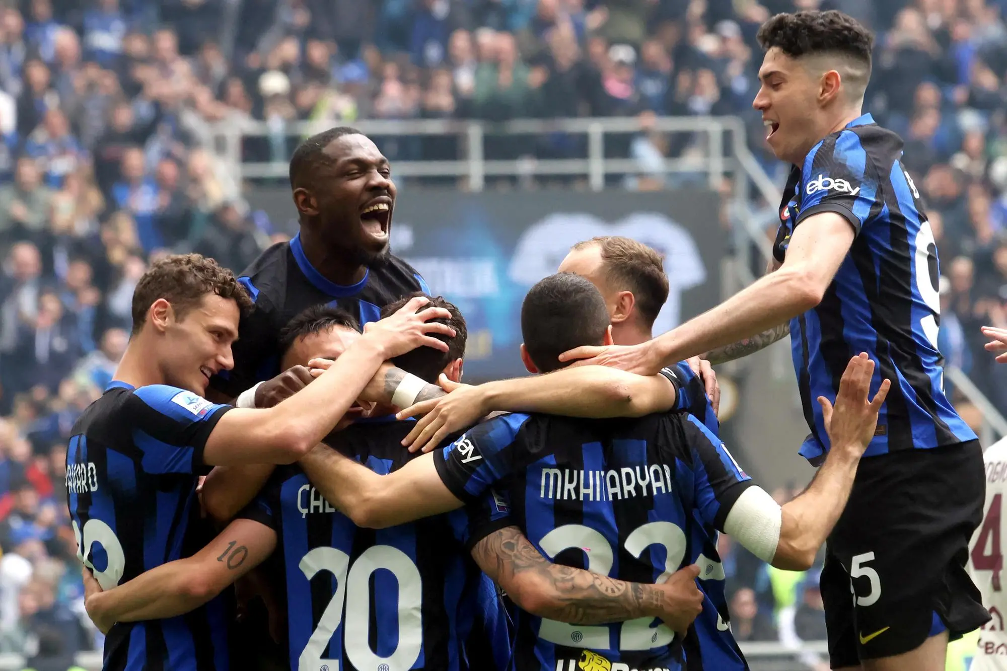 Inter Milan’s Hakan Calhanoglu jubilates with his teammates after scoring goal of 2 to 0 during the Italian serie A soccer match between Fc Inter and Torino at Giuseppe Meazza stadium in Milan, 28 April 2024. ANSA / MATTEO BAZZI