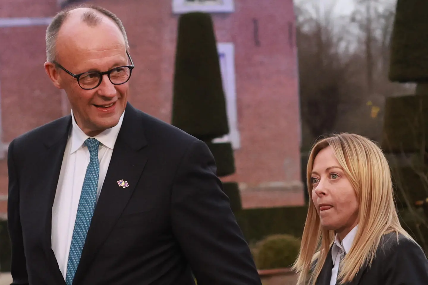 epa12731632 German Federal Chancellor Friedrich Merz , Italian Prime Minister Giorgia Meloni after Family photo during EU leaders to an informal retreat at Alden Biesen Castle in Bilzen, Belgium, 12 February 2026. The strategic session focuses on deepening the Single Market, boosting investment, and enhancing Europe's competitiveness in a shifting geoeconomic landscape. EPA/OLIVIER HOSLET