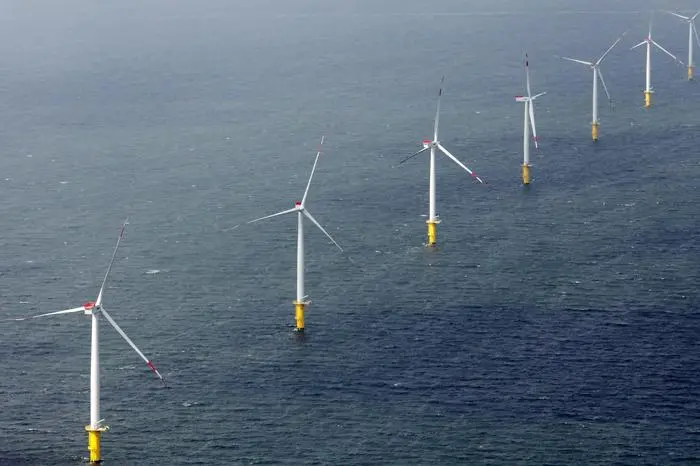 epa03819116 A handout provided by EWE AG dated 10 August 2013 shows wind turbines of the Offshore wind park Riffgat near Borkum, Germany. The wind park is not yet connected to the electricity grid, and will only deliver power in February 2014. EPA/Markus Hibbeler / HANDOUT HANDOUT EDITORIAL USE ONLY/NO SALES