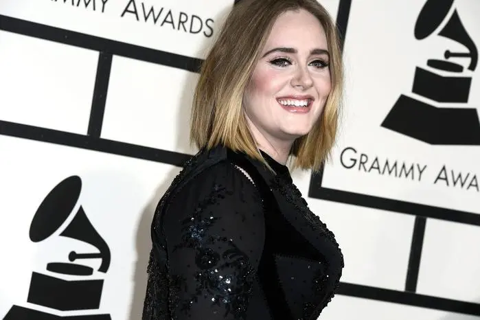 epa05662582 (FILE) A file picture dated 15 February 2016, of British singer Adele arriving for the 58th annual Grammy Awards at the Staples Center in Los Angeles, California, USA. The 2017 Grammy nominees were announced 06 December 2016, with Adele receiving five nominations, including Record of the Year. EPA/PAUL BUCK