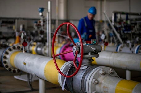 epa10122765 An employee checks pipework at the underground gas storage facility operated by RWE Gas Storage CZ near Haje u Pribrami, Czech Republic, 15 August 2022. The voluntary commitment by EU member states from the summer 2022 to reduce gas consumption by 15% means that the Czech Republic will have to save about a billion cubic meters at the national level. EPA/MARTIN DIVISEK