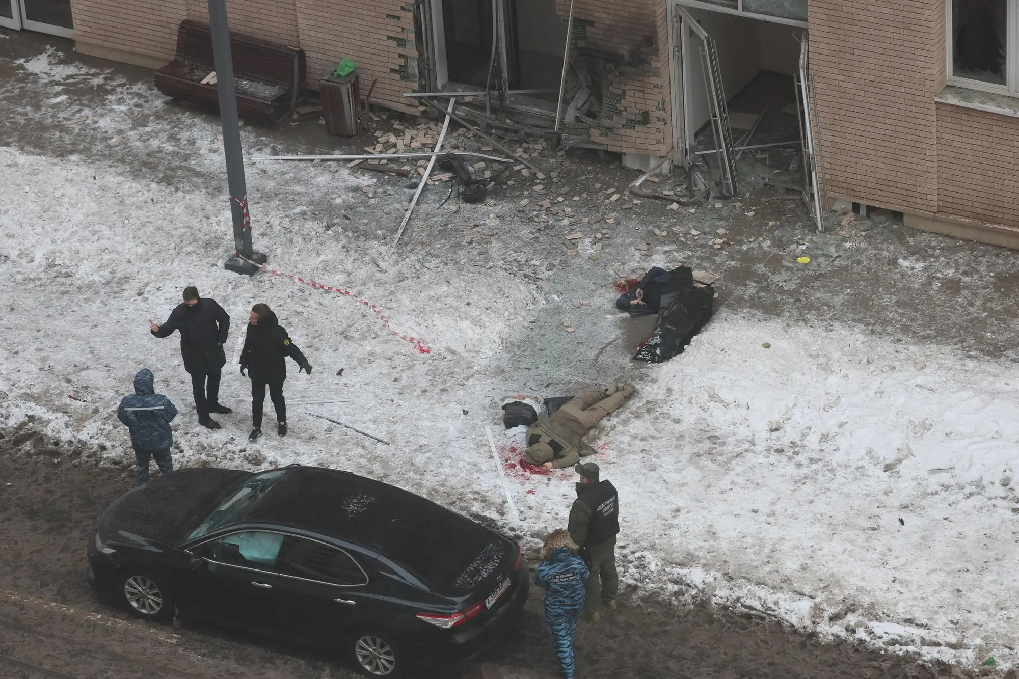 epaselect epa11781938 A view of a scene of an explosion in Moscow, Russia, 17 December 2024. According to a statement by the Investigative Committee of Russia, Lieutenant General Igor Kirillov and his assistant were killed in a blast outside of an apartment building in Moscow. The committee's statement said the explosive was hidden inside of an electric scooter. EPA/YURI KOCHETKOV