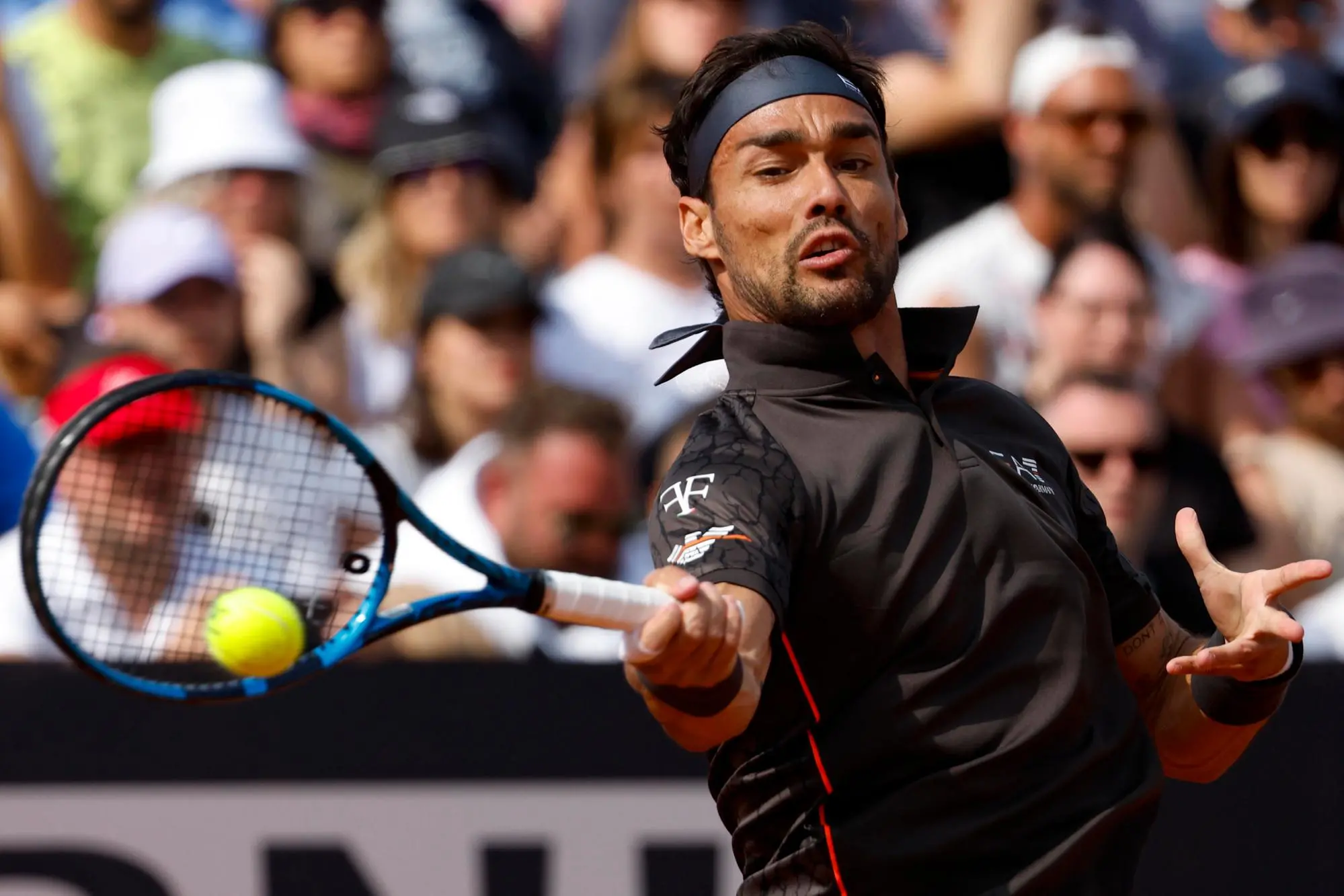 Fabio Fognini of Italy in action during his men's singles second round match against Miomir Kecmanovic from Serbia (not pictured) at the Italian Open tennis tournament in Rome, Italy, 12 May 2023. ANSA/FABIO FRUSTACI