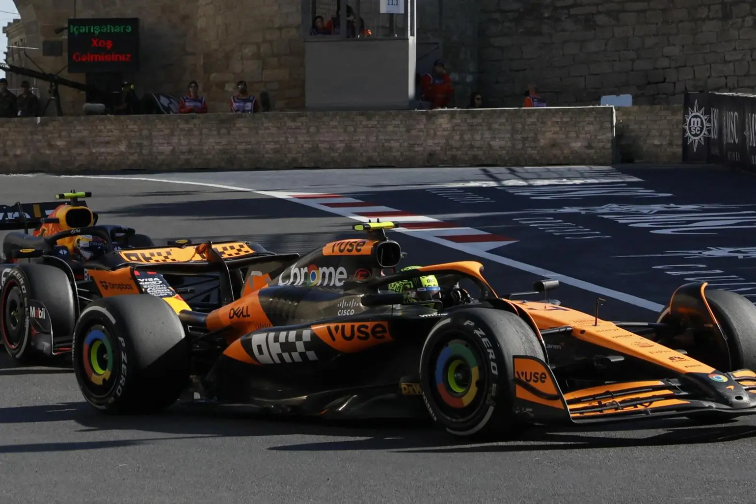 epa11605510 Australian driver Oscar Piastri (front) of McLaren F1 Team and Mexican driver Sergio Perez of Red Bull Racing in action during the 2024 Formula One Grand Prix of Azerbaijan, at the Baku City Circuit in Baku, Azerbaijan, 15 September 2024. EPA/YURI KOCHETKOV