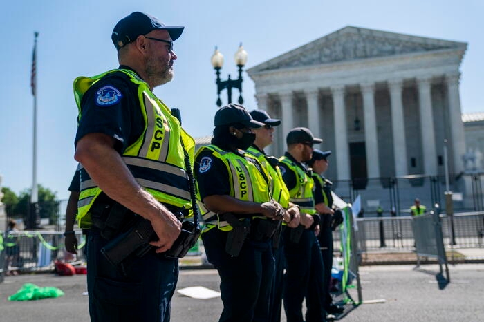 epa10014562 US Capitol Police separate anti-abortion activists and abortion rights activists as they protest at the Supreme Court in Washington, DC, USA, 15 June 2022. Protests and rallies continue in reaction to the opinion on a leaked draft that suggested the United States Supreme Court could soon overturn the legalization of abortion in the Roe v. Wade case of 1973. EPA/SHAWN THEW