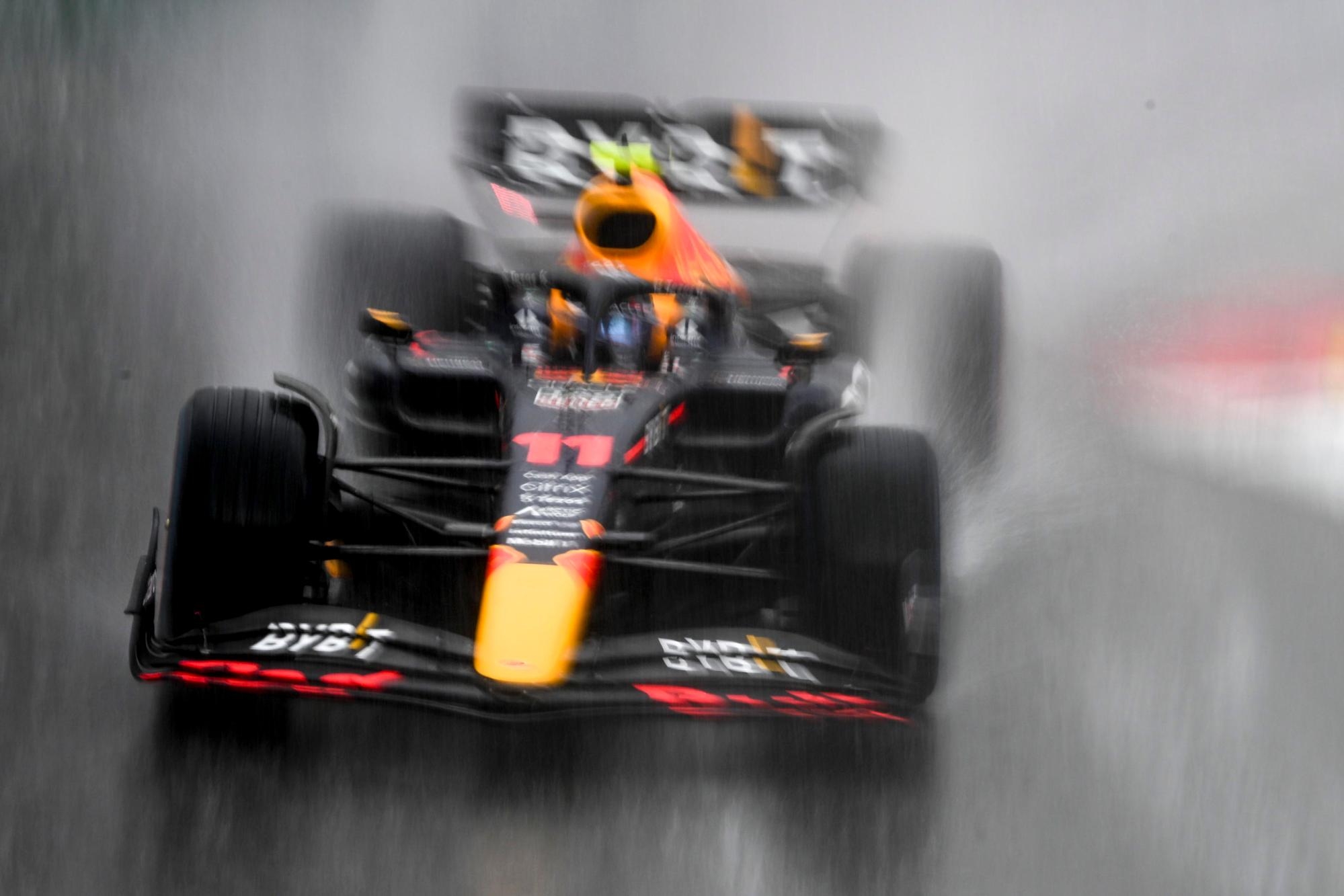 epa09984280 Mexican Formula One driver Sergio Perez of Red Bull Racing in action in the pouring rain during a formation lap for the start of the Formula One Grand Prix of Monaco at the Circuit de Monaco in Monte Carlo, Monaco, 29 May 2022. EPA/CHRISTIAN BRUNA
