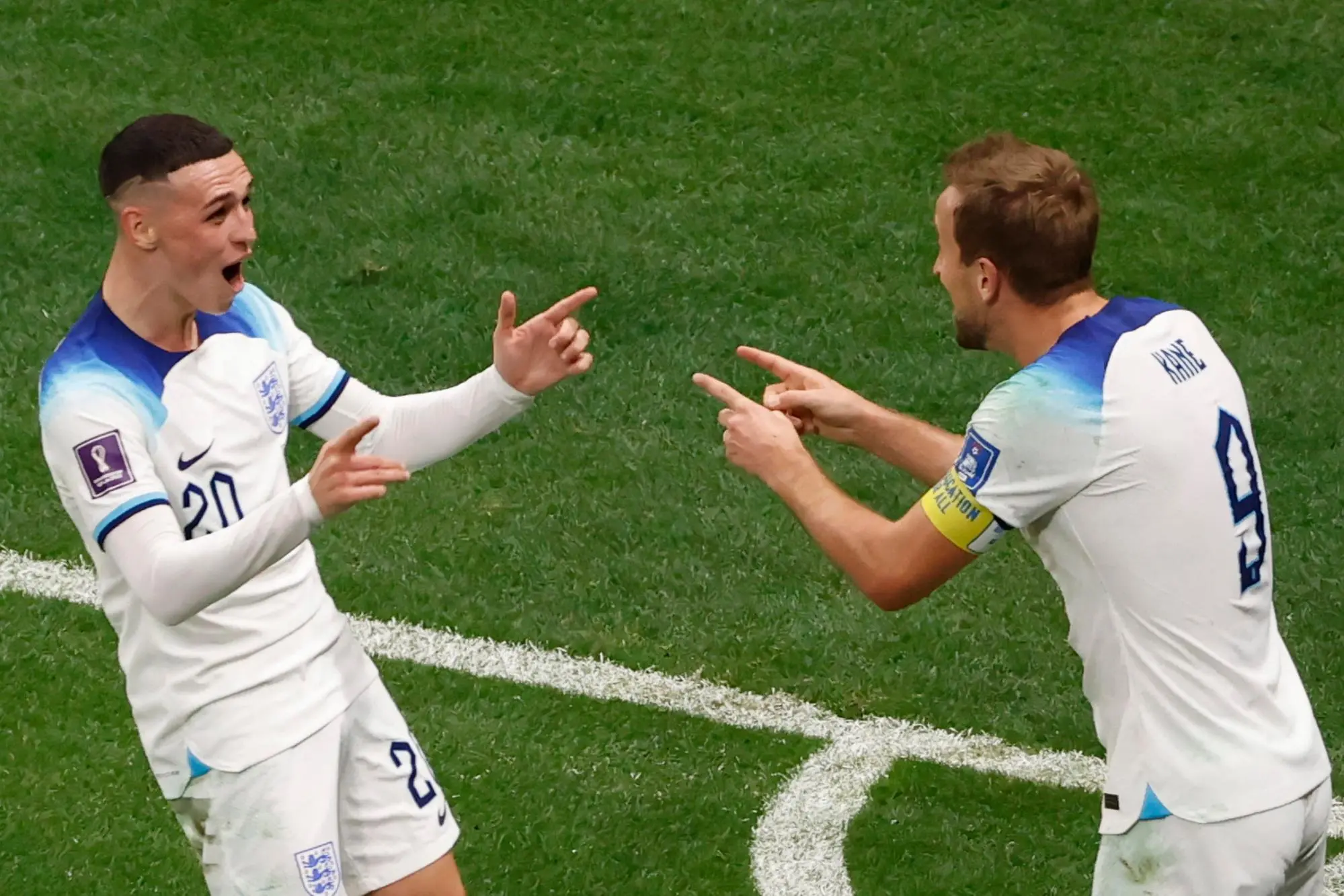 epa10348670 Harry Kane of England celebrates scoring the 2-0 goal with his teammate Phil Foden during the FIFA World Cup 2022 round of 16 soccer match between England and Senegal at Al Bayt Stadium in Al Khor, Qatar, 04 December 2022. EPA/Rolex dela Pena