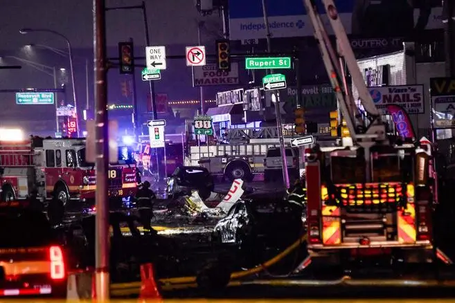 PHILADELPHIA, PENNSYLVANIA - JANUARY 31: Emergency service members respond to a plane crash in a neighborhood near Cottman Avenue on January 31, 2025 in Philadelphia, Pennsylvania. The plane, a medical transport jet carrying a child patient, crashed after taking off from Northeast Philadelphia Airport, damaging several homes and vehicles. Matthew Hatcher/Getty Images/AFP (Photo by Matthew Hatcher / GETTY IMAGES NORTH AMERICA / Getty Images via AFP)