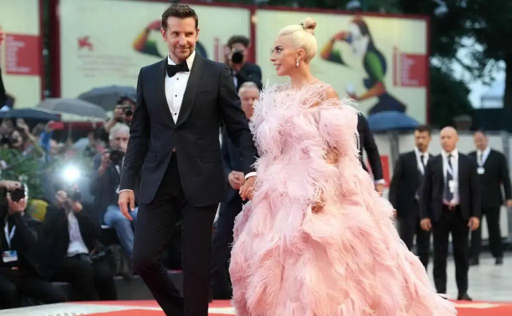 È &quot;Shallow&quot;, colonna sonora di &quot;A Star is Born&quot; in cui recita con Bradley Cooper (tutte le foto sono Ansa)