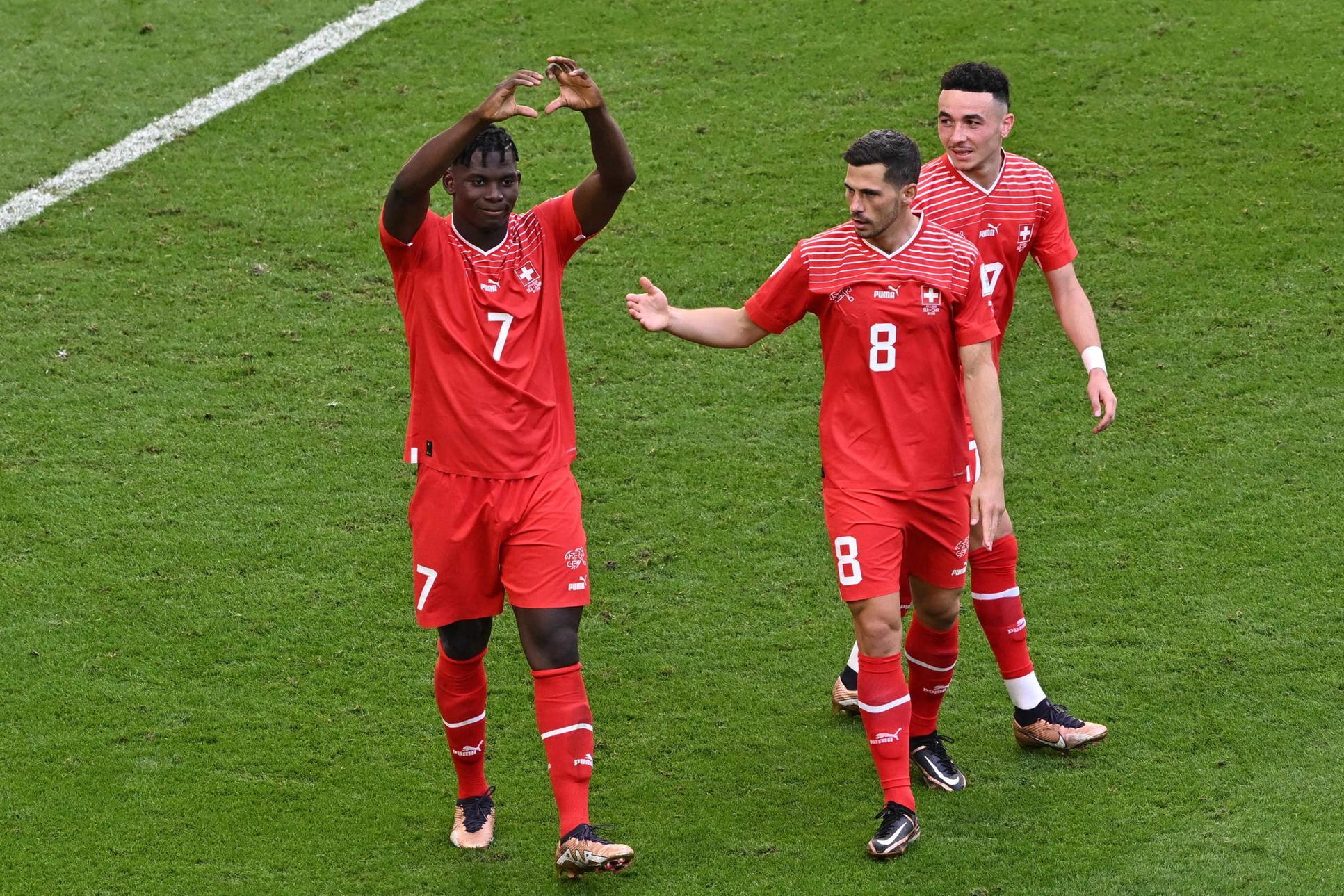 epa10324539 Breel Embolo of Switzerland celebrates scoring the 1-0 with Remo Freuler (C) during the FIFA World Cup 2022 group G soccer match between Switzerland and Cameroon at Al Janoub Stadium in Al Wakrah, Qatar, 24 November 2022. EPA/Noushad Thekkayil