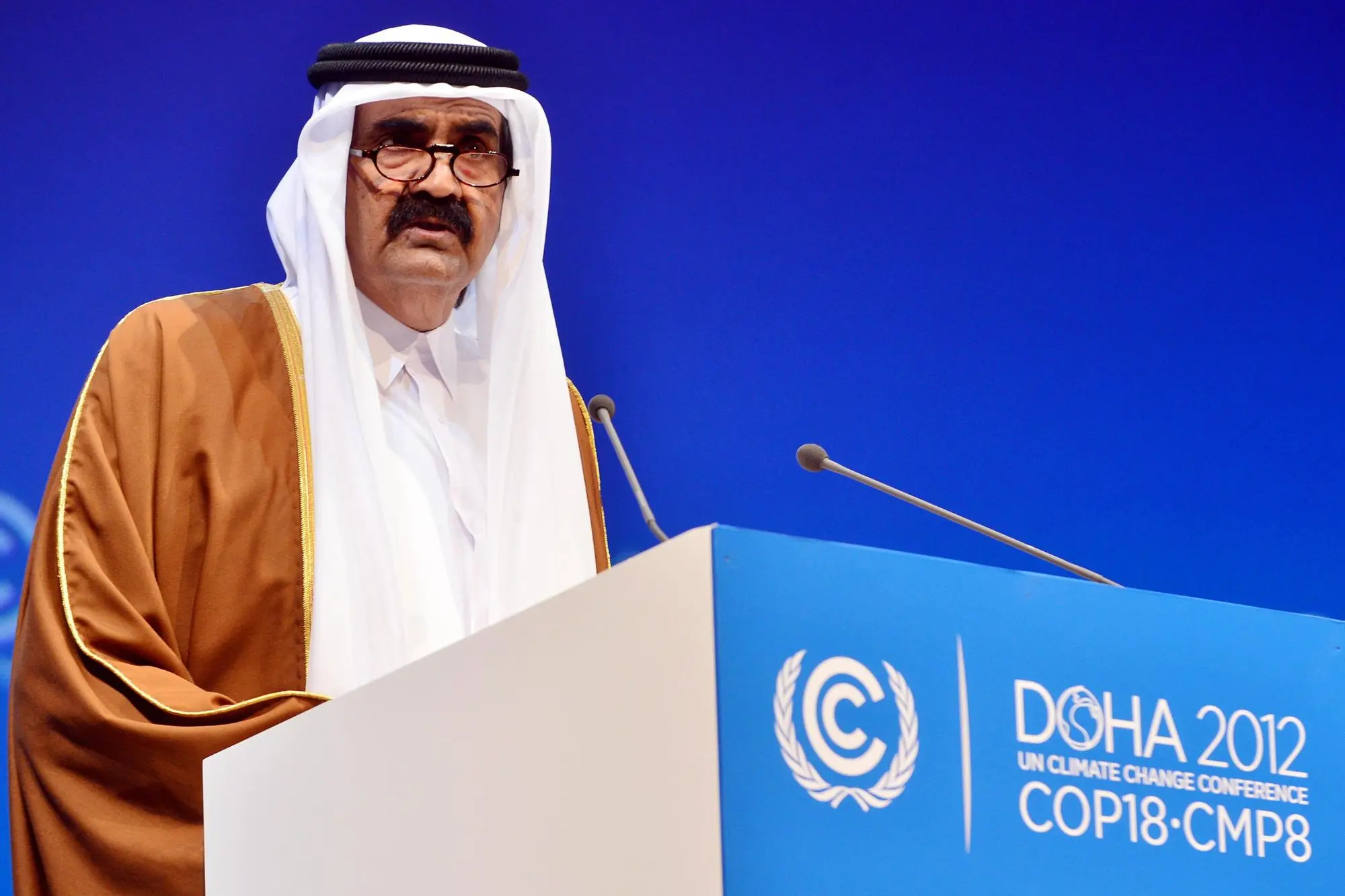 epa13106564 (FILE) Qatari Emir, Sheikh Hamad bin Khalifa Al-Thani, delivers his speech during the plenary session of the High Level Segment of the 18th Conference of the Parties (COP18) to the United Nations Framework Convention on Climate Change (UNFCCC) and the 8th Meeting of the Parties to the Kyoto Protocol (CMP8), in Doha, Qatar, 04 December 2012 (reissued 12 July 2026). Former Emir of Qatar Sheikh Hamad bin Khalifa al-Thani died on 12 July 2026, at the age of 74, according to a statement released by Amiri Diwan of Qatar. EPA/STR *** Local Caption *** 50622019