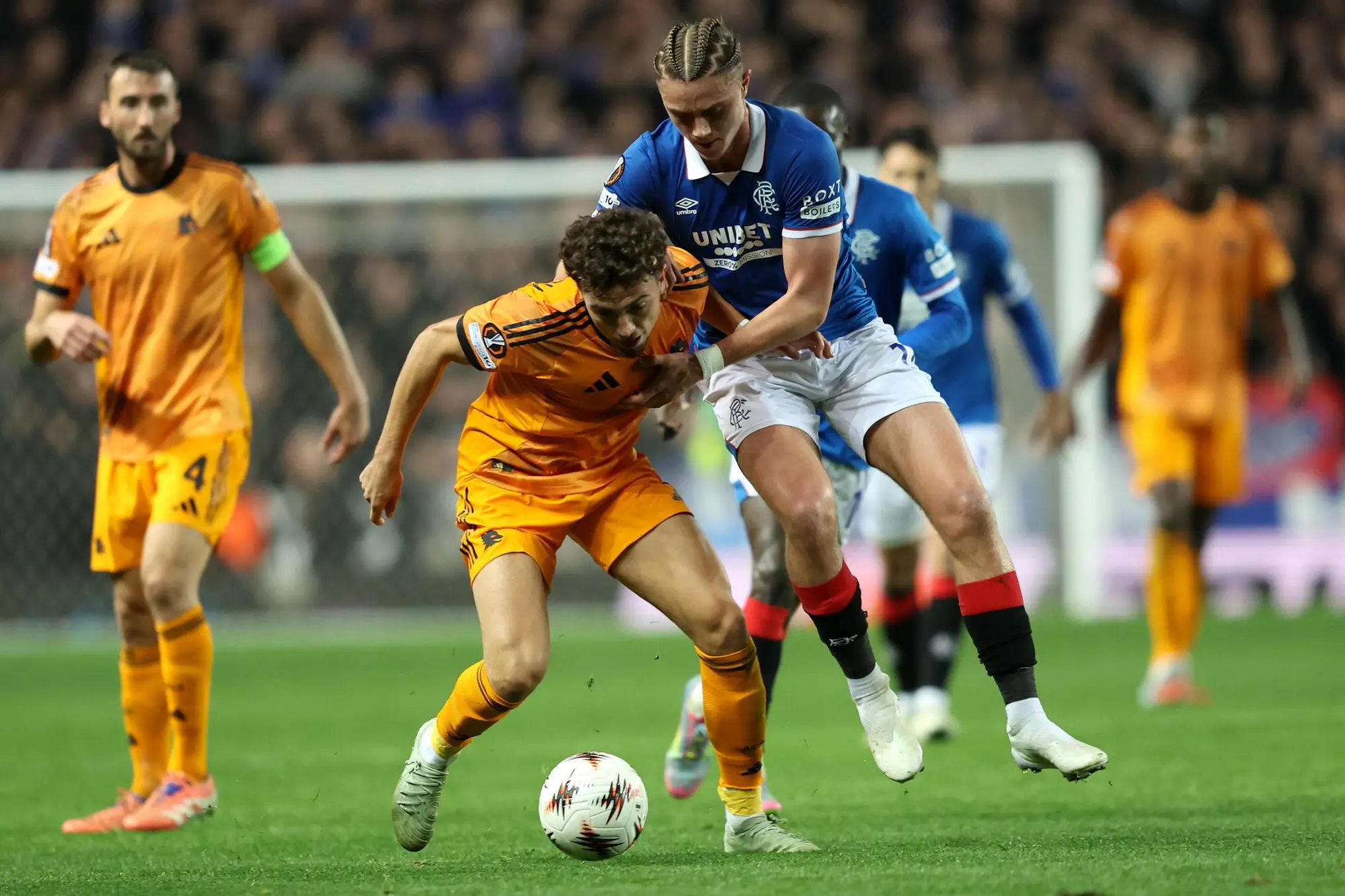 epa12509377 Thelo Aasgaard (R) of Rangers in action against Neil El Aynaoui of Roma during the UEFA Europa League league phase match between Rangers FC and AS Roma, in Glasgow, Scotland, Britain, 06 November 2025. EPA/ROBERT PERRY