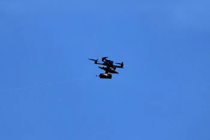 epa12974289 A FPV drone, via fiber-optic cables, launched by Hezbollah from south Lebanon, as seen from the upper Galilee on the Israel-Lebanon border, 19 May 2026. EPA/ATEF SAFADI