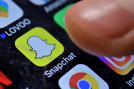 epa06316590 A close-up image showing the Snapchat app on an iPhone in Kaarst, Germany, 08 November 2017. EPA/SASCHA STEINBACH ILLUSTRATION