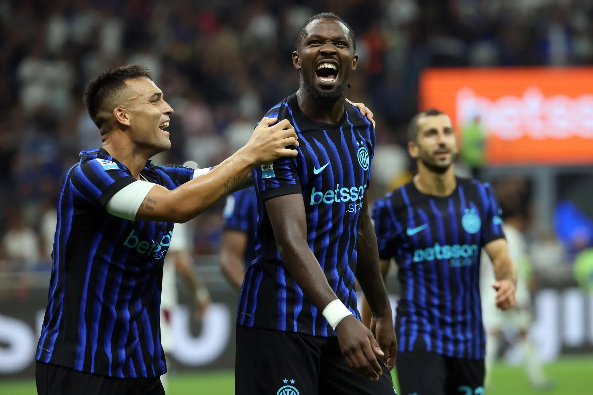 Inter Milan’s Marcus Thuram (R) jubilates with his teammate Inter Milan’s Lautaro Martinez after scoring goal go 4 to 0 during the Italian serie A soccer match between Inter and Torino at Giuseppe Meazza stadium in Milan, 25 August 2025. ANSA / MATTEO BAZZI