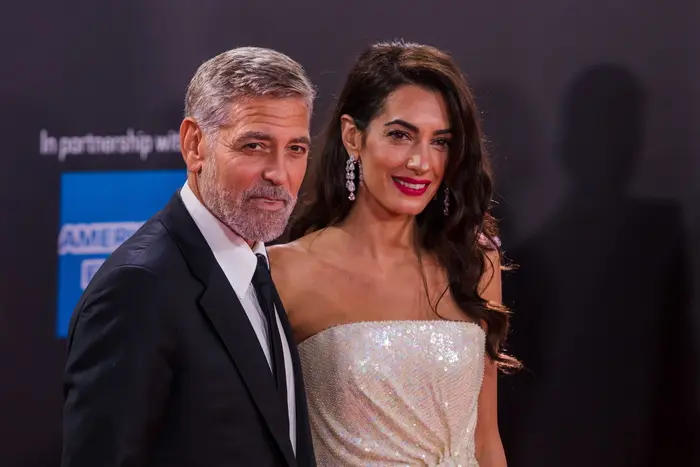 George Clooney e sua moglie Amal (Ansa)