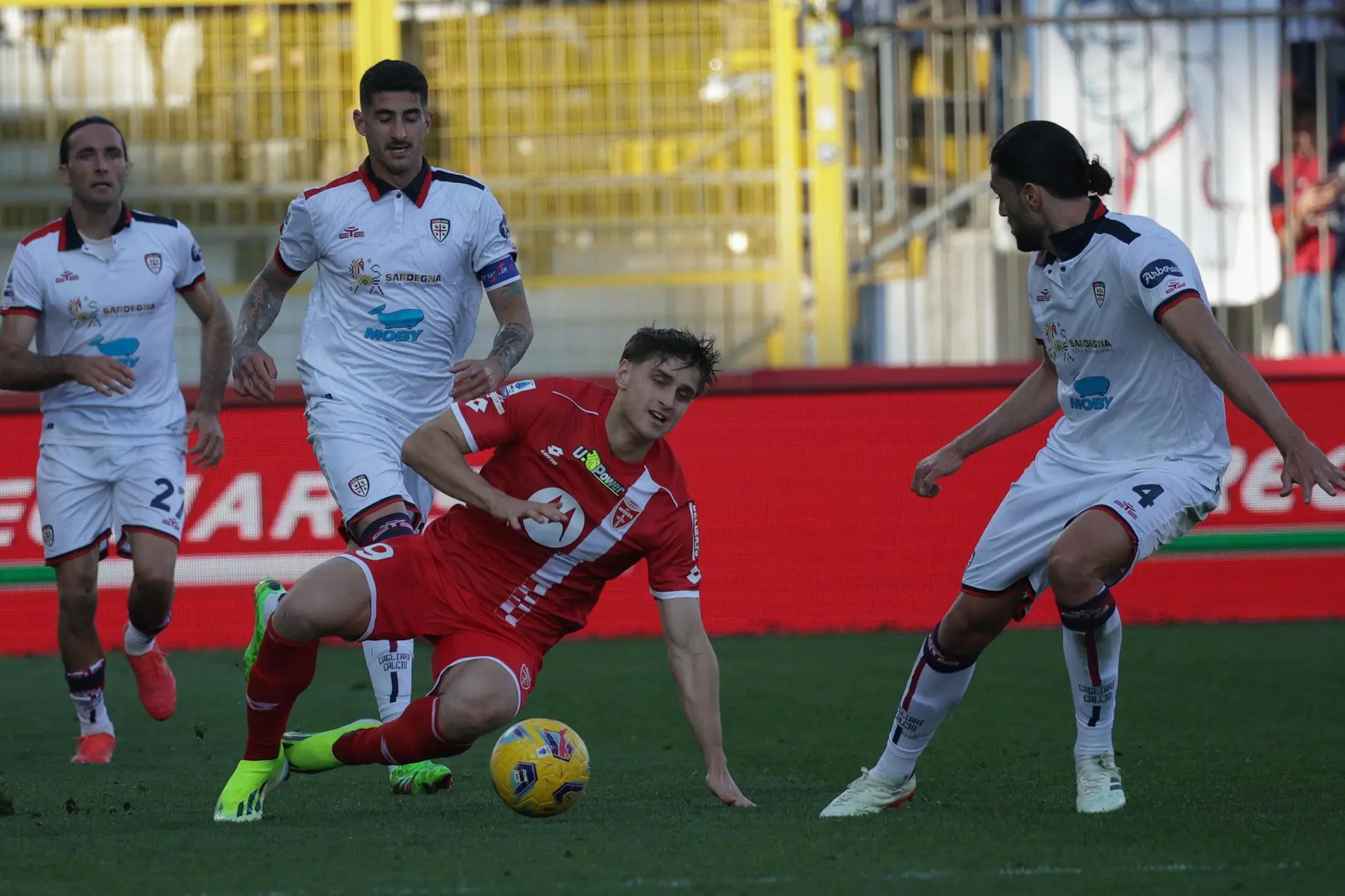 AC Monza's forward Lorenzo Colombo in action against Cagliari's defender Alberto Dossena during the Italian Serie A soccer match between AC Monza and Cagliari at U-Power Stadium in Monza, Italy, 16 March 2024. ANSA / ROBERTO BREGANI