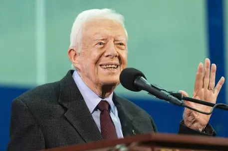 FILE - In this Sept. 18, 2019, file photo former President Jimmy Carter acknowledges a student who's question has been picked for him to answer during an annual Carter Town Hall held at Emory University in Atlanta. Carter has been hospitalized after a fall at his home in Plains, Ga. A statement from The Carter Center says Carter suffered "a minor pelvic fracture" on Monday, Oct. 21 but remains in good spirits and looks forward to recovering at home. (ANSA/AP Photo/John Amis, File) [CopyrightNotice: Copyright 2019 The Associated Press. All rights reserved]