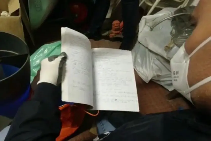 Sequestrati anche testi relativi a pratiche esoteriche (frame video polizia di Torino)
