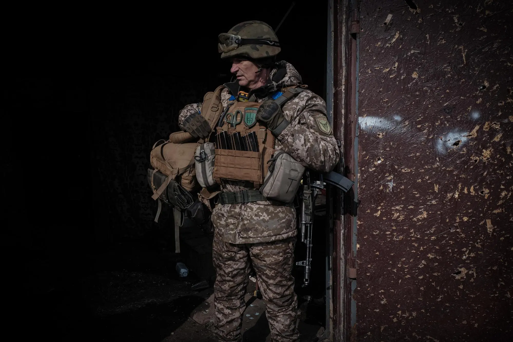 epa10507970 A Ukrainian soldier from the Volyn Detachment patrols the devastated town of Velyka Novosilka, Donetsk region, Ukraine, 07 March 2023. There are less than 500 people still living in the town, because the Russian positions are less than a kilometer away and the shelling is continuous. Russian troops entered Ukrainian territory on 24 February 2022, starting a conflict that has provoked destruction and a humanitarian crisis. EPA/MARIASENOVILLA