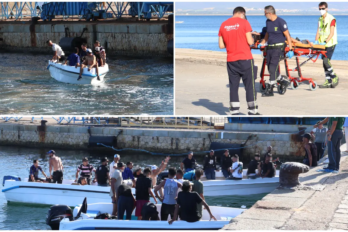 I migranti e i soccorsi per il ragazzo ferito (foto Murru)