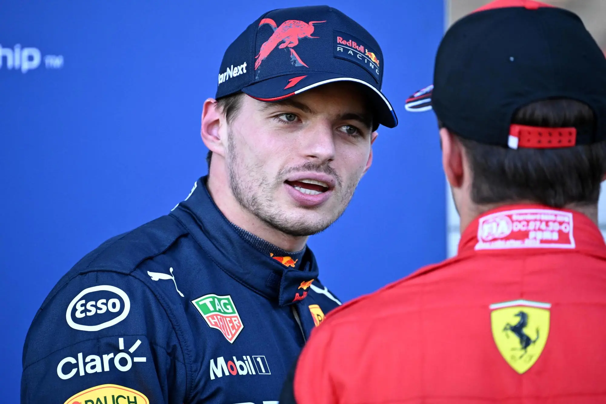 epa10059845 First placed Dutch Formula One driver Max Verstappen (L) of Red Bull Racing talks to second placed Monaco's Formula One driver Charles Leclerc of Scuderia Ferrari after the qualifying for the Formula One Grand Prix of Austria at the Red Bull Ring in Spielberg, Austria, 08 July 2022. EPA/CHRISTIAN BRUNA / POOL
