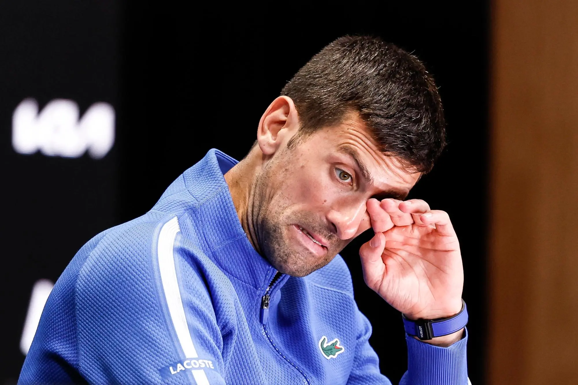 epa11105096 Novak Djokovic of Serbia reacts during a press conference after losing the Men's semi final match against Jannik Sinner of Italy at the Australian Open tennis tournament in Melbourne, Australia, 26 January 2024. EPA/MAST IRHAM