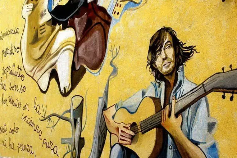 Fabrizio De André ritratto in un murale di Orgosolo