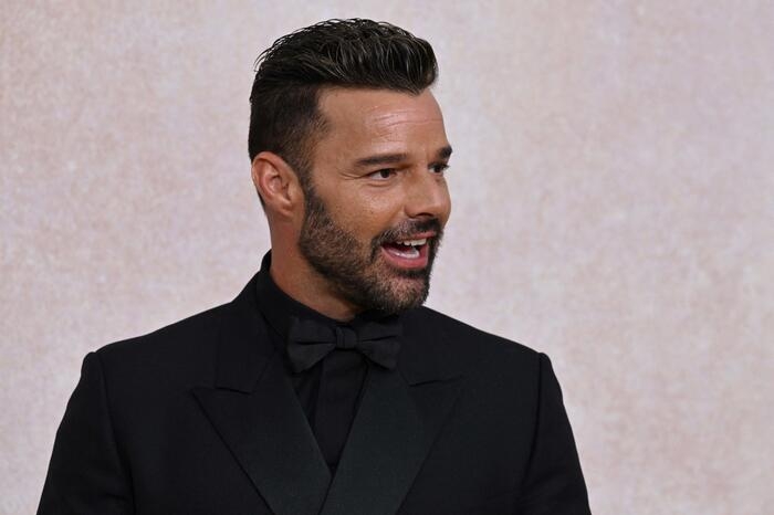 Puerto Rican singer actor Ricky Martin arrives on May 26, 2022 to attend the annual amfAR Cinema Against AIDS Cannes Gala at the Hotel du Cap-Eden-Roc in Cap d'Antibes, southern France, on the sidelines of the 75th Cannes Film Festival. (Photo by Stefano Rellandini / AFP)