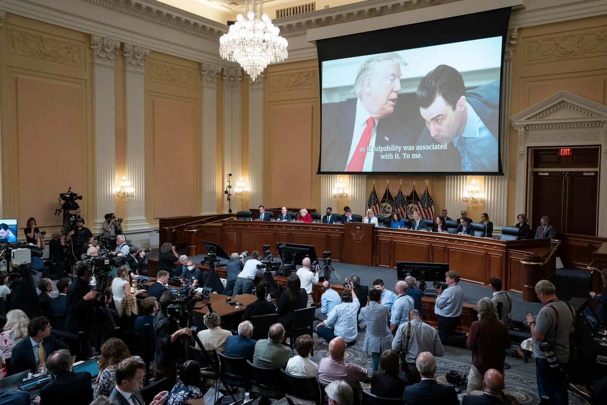 epa10085837 A video of a photograph of President Donald Trump (L), and aid Nick Luna, is shown on a screen,, as the House select committee investigating the January 6 attack on the US Capitol holds a hearing, at the Capitol, in Washington, DC, USA, 21 July 2022. EPA/Alex Brandon / POOL