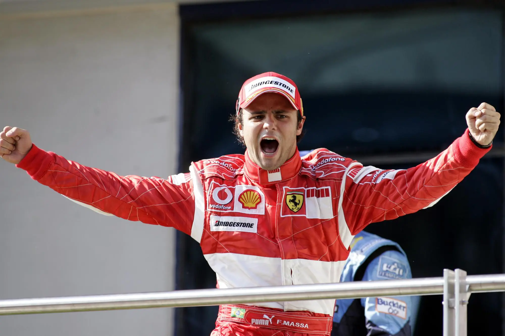 Ferrari Formula One driver Felipe Massa of Brazil celebrates on the podium after winning the Formula One Turkish Grand Prix at the Istanbul Park racing track in Istanbul, Turkey, Sunday, Aug. 27, 2006. Felipe Massa of Ferrari won the Turkish Grand Prix, his first Formula One victory after starting from the pole position. Renault's Fernando Alonso held off Ferrari's Michael Schumacher in a thrilling duel over the last 13 laps to take second and increase his lead slightly over the German in the season standings. (AP Photo/Murad Sezer)