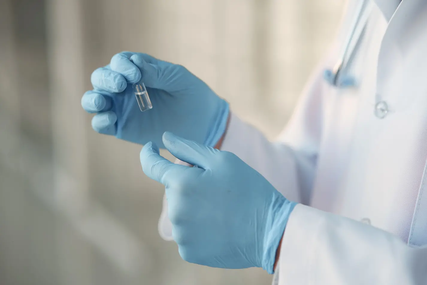 Medical student at the hall. Person in a white uniform. Coronavirus theme.