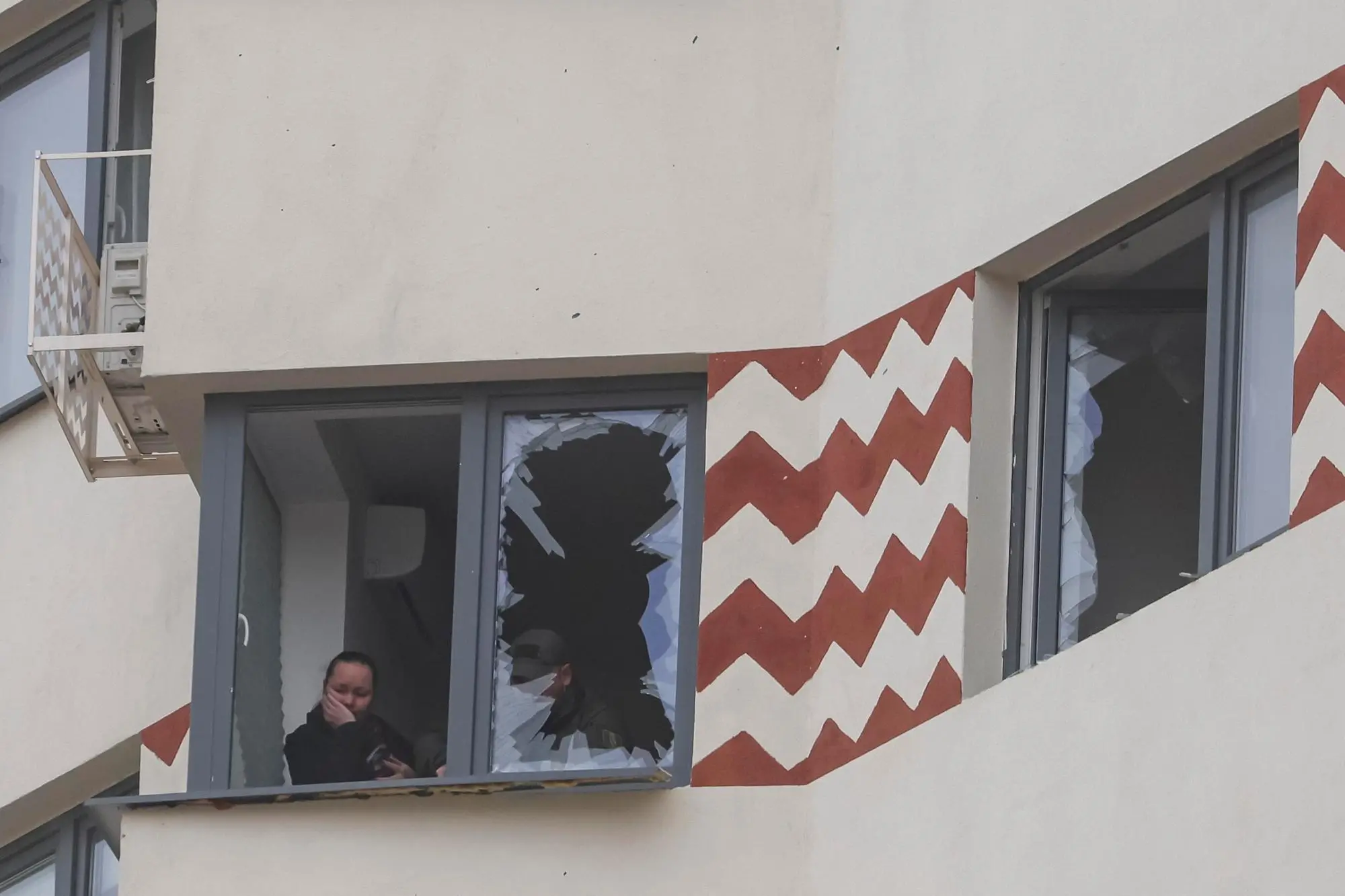 epa11954932 A local resident examines the damage to her apartment following a Ukrainian drone attack in Vidnoye, Moscow region, Russia, 11 March 2025. . According to the Russian Ministry of Defense 337 drones were intercepted and destroyed including 91 drones over the Moscow region EPA/SERGEI ILNITSKY