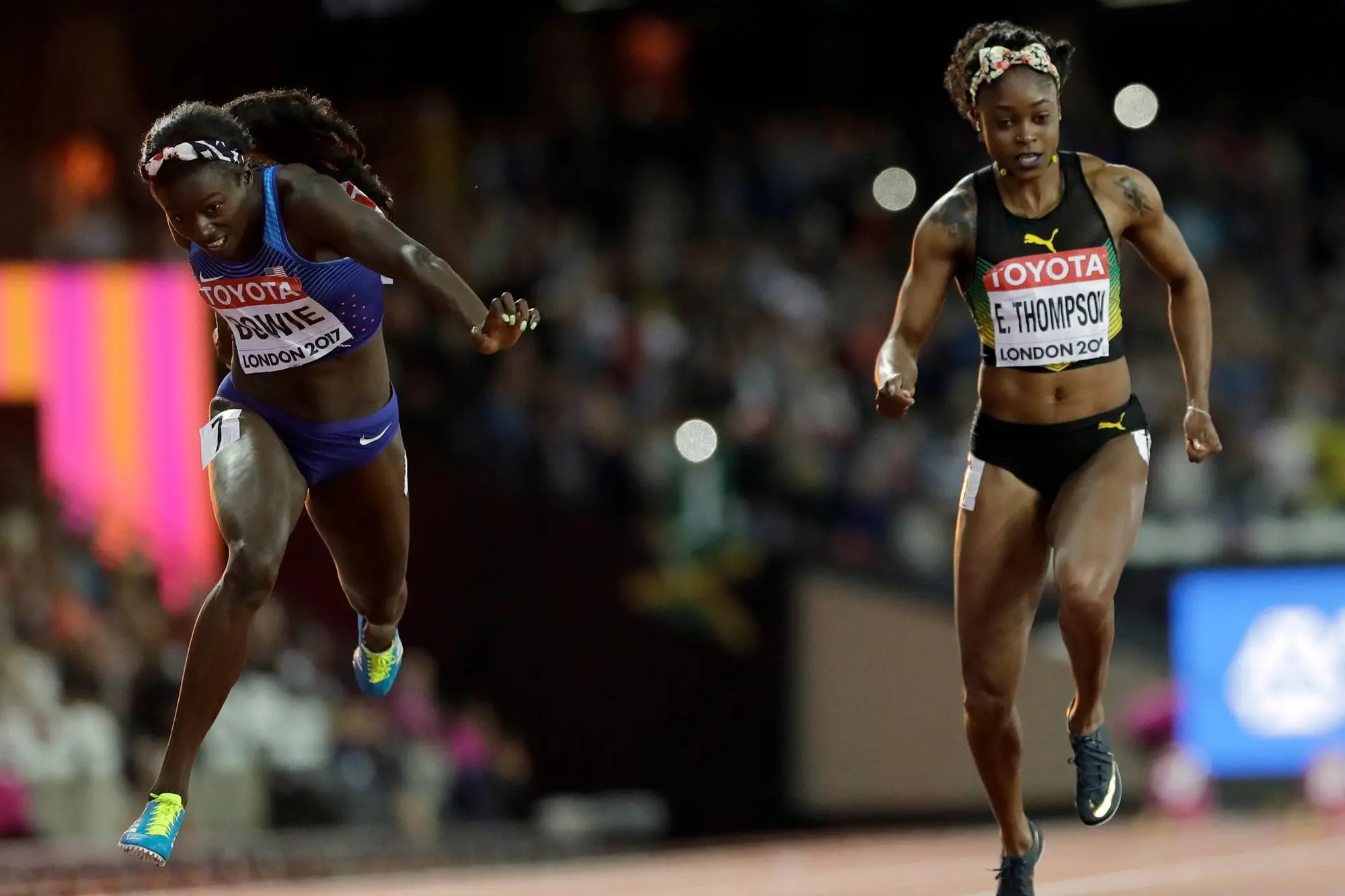 United States' Tori Bowie, left, dips to win the gold medal in the Women's 100m final during the World Athletics Championships in London Sunday, Aug. 6, 2017. (AP Photo/David J. Phillip)