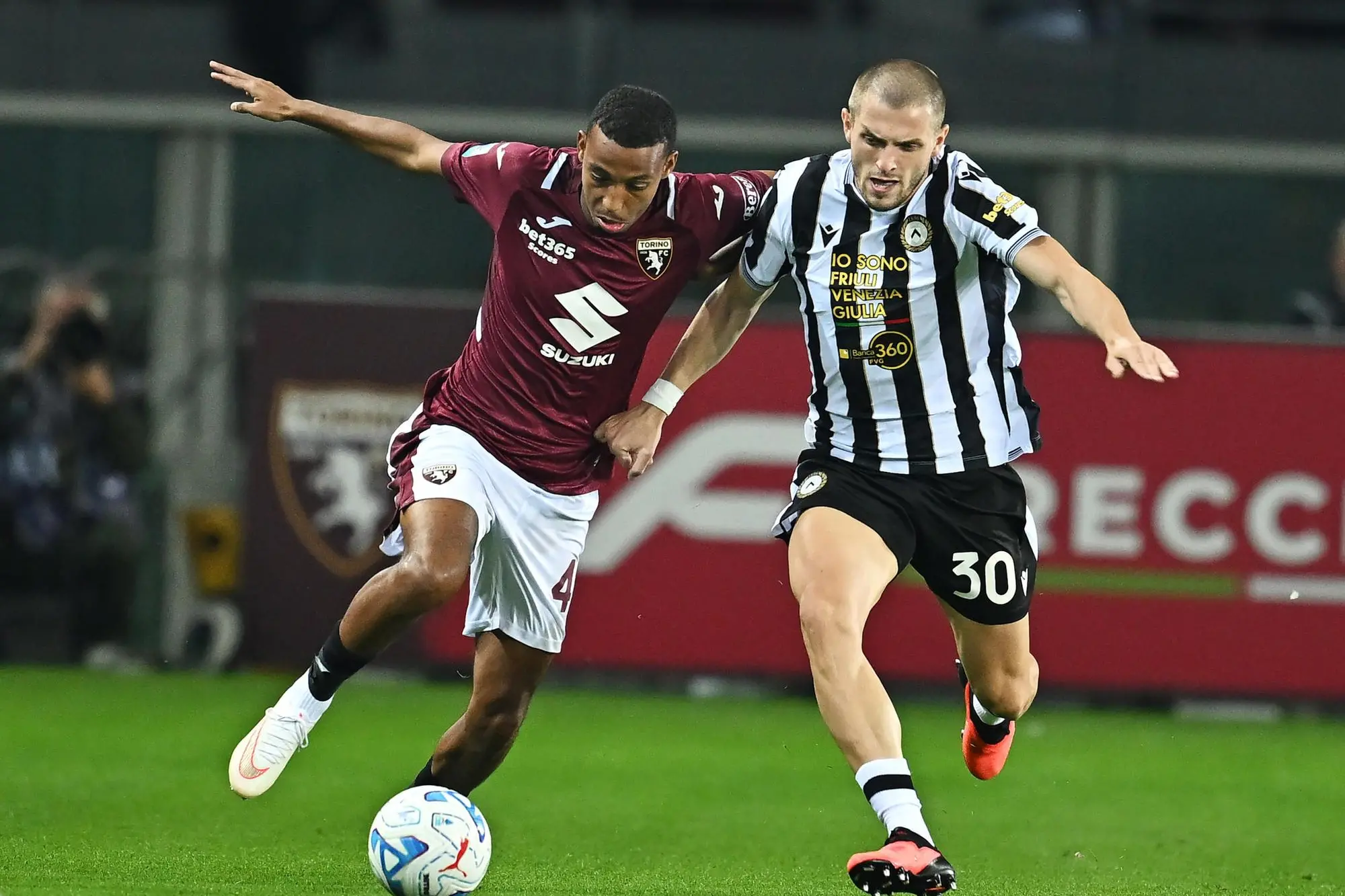 Torino's Rafok Belghali and Udinese's Giorgi Chakvetadze in action during the Italian Serie A soccer match Torino FC vs Udinese Calcio at Olimpico Grande Torino stadium in Turin, italy, 12 october 2026 ANSA/ ALESSANDRO DI MARCO