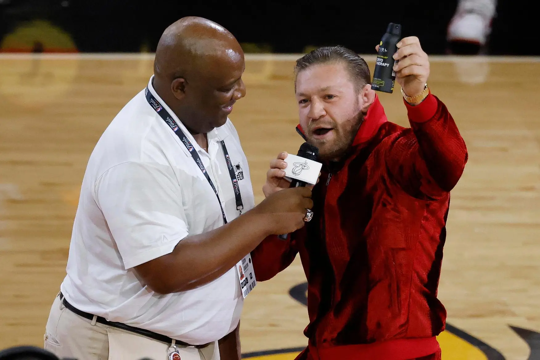 epa10684683 Irish mixed martial artist Conor McGregor (R) speaks during half-time in game four of the NBA Finals between the Denver Nuggets and Miami Heat at Kaseya Center in Miami, Florida, USA, 09 June 2023 (issued 11 June 2023). EPA/RHONA WISE SHUTTERSTOCK OUT