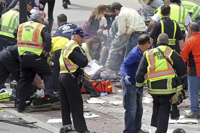 epa03663569 The aftermath of a bomb blast near the finish line on Boylston Street, the scene after the bomb blasts at the 117th running of the Boston Marathon. Monday, April 15, 2013. EPA/STUART CAHILL / THE BOSTON HERAL MANDATORY CREDIT THE BOSTON HERALD, NO SALES, EDITORIAL USE ONLY