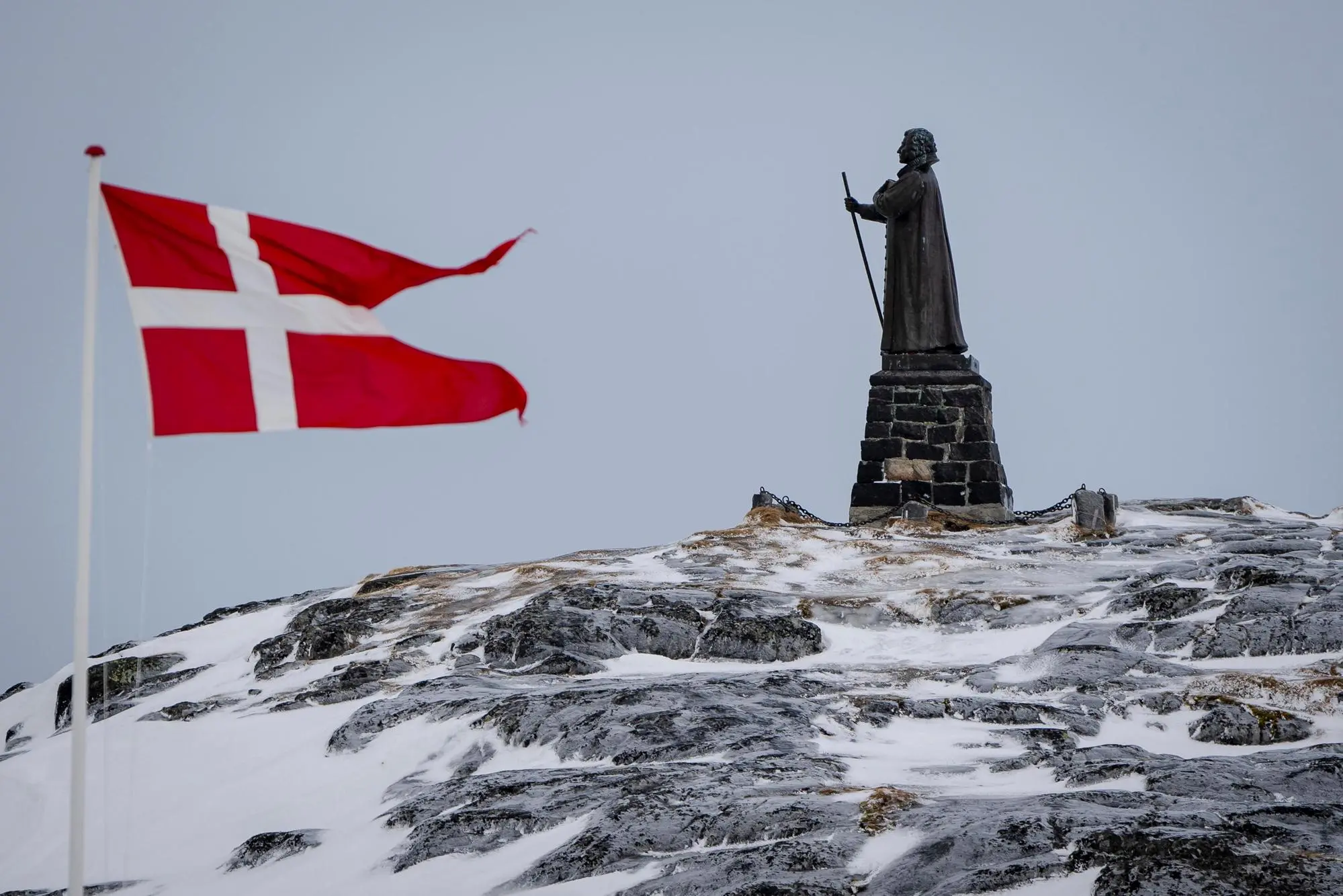 epa11953194 A view of the Dannebrog and Hans Egede Statue in Nuuk, Greenland, 09 March 2025 (issued 10 March 2025). Greenlanders are holding elections for Greenland's parliament, Inatsisartut, on 11 March 2025. EPA/Mads Claus Rasmussen DENMARK OUT