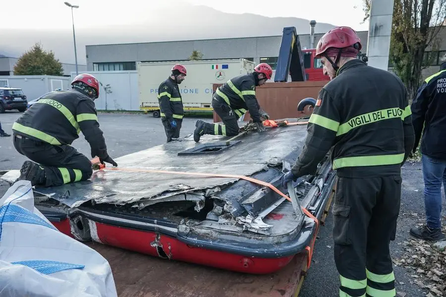 Wreckage of the cabin of the Mottarone cable car, crashed last May, are unloaded in a storage by the Italian Firefighters, in Stresa, Italy, 08 novembre 2021. ANSA/TINO ROMANO