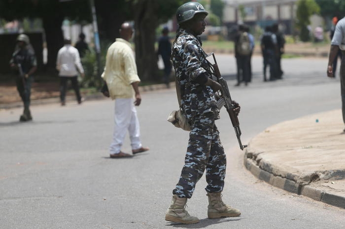 epa09208989 A policeman stands guard after dispersing members of the Nigeria Labour Congress during a mass rally to protest against the unlawful mass sack of civil service workers in Nigeria northern city of Kaduna, 18 May 2021. The recent mass retrenchment of workers in the Kaduna state civil service by the state Governor Nasir El-Rufai has sparked a nation-wide outrage with NLC asking for a reversal of actions capable of plunging the state in further crisis. Kaduna state has been the epicenter of recent kidnapping of students in the Federal College of Forestry Mechanization and Greenfield University, by criminal bandits. EPA/AKINTUNDE AKINLEYE