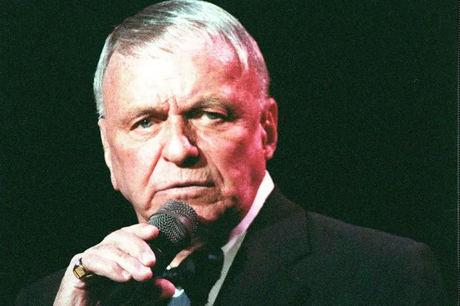 FILE--Frank Sinatra performs during a concert in London in this May 26, 1992 file photo. Sinatra has beaten Elvis Presley in a poll of the 20th century's greatest voices, the British Broadcasting Corp. said Saturday, April 14, 2001. (AP Photo/PA-Adam Butler, File) **UNITED KINGDOM OUT**